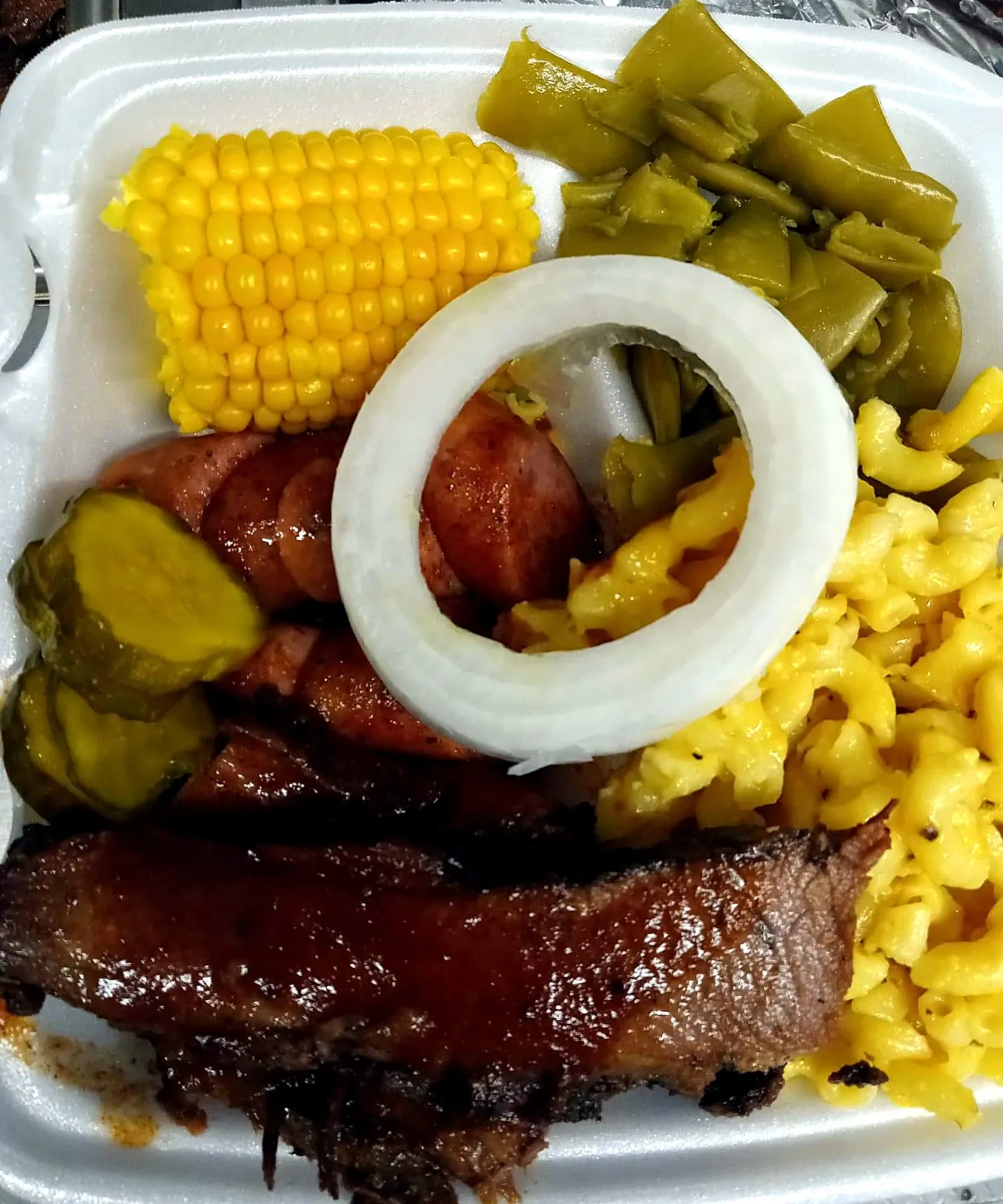 Sausage and brisket plate with corn, mac & cheese and green beans